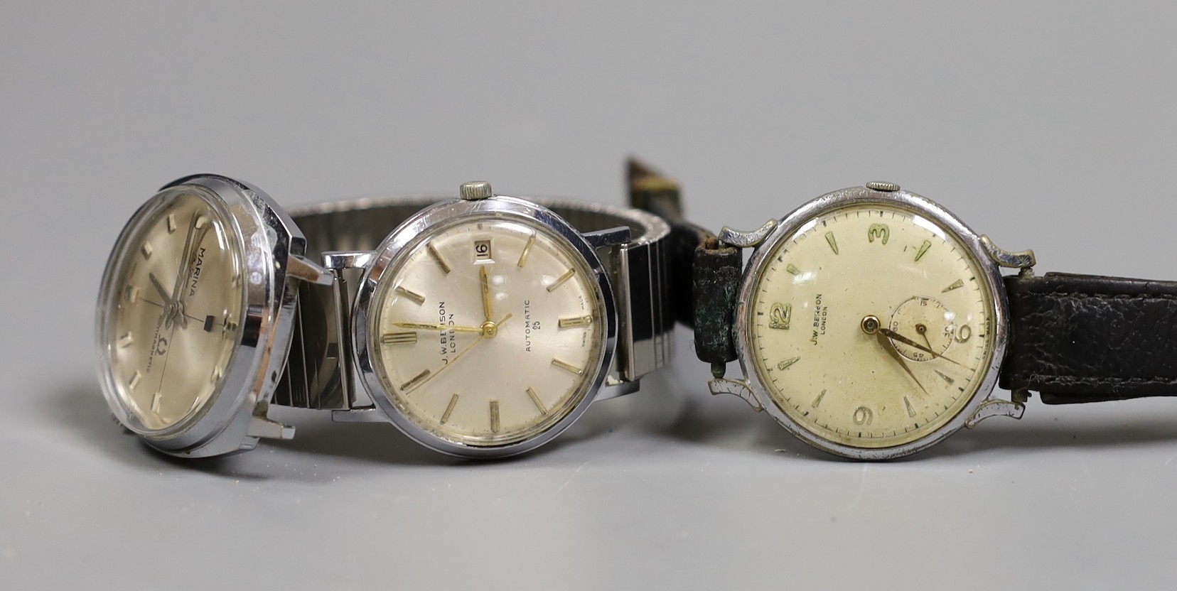 A gentleman's stainless steel J.W. Benson automatic wrist watch, a J.W. Benson stainless steel manual wind wrist watch and a steel Marina watch (lacking strap).